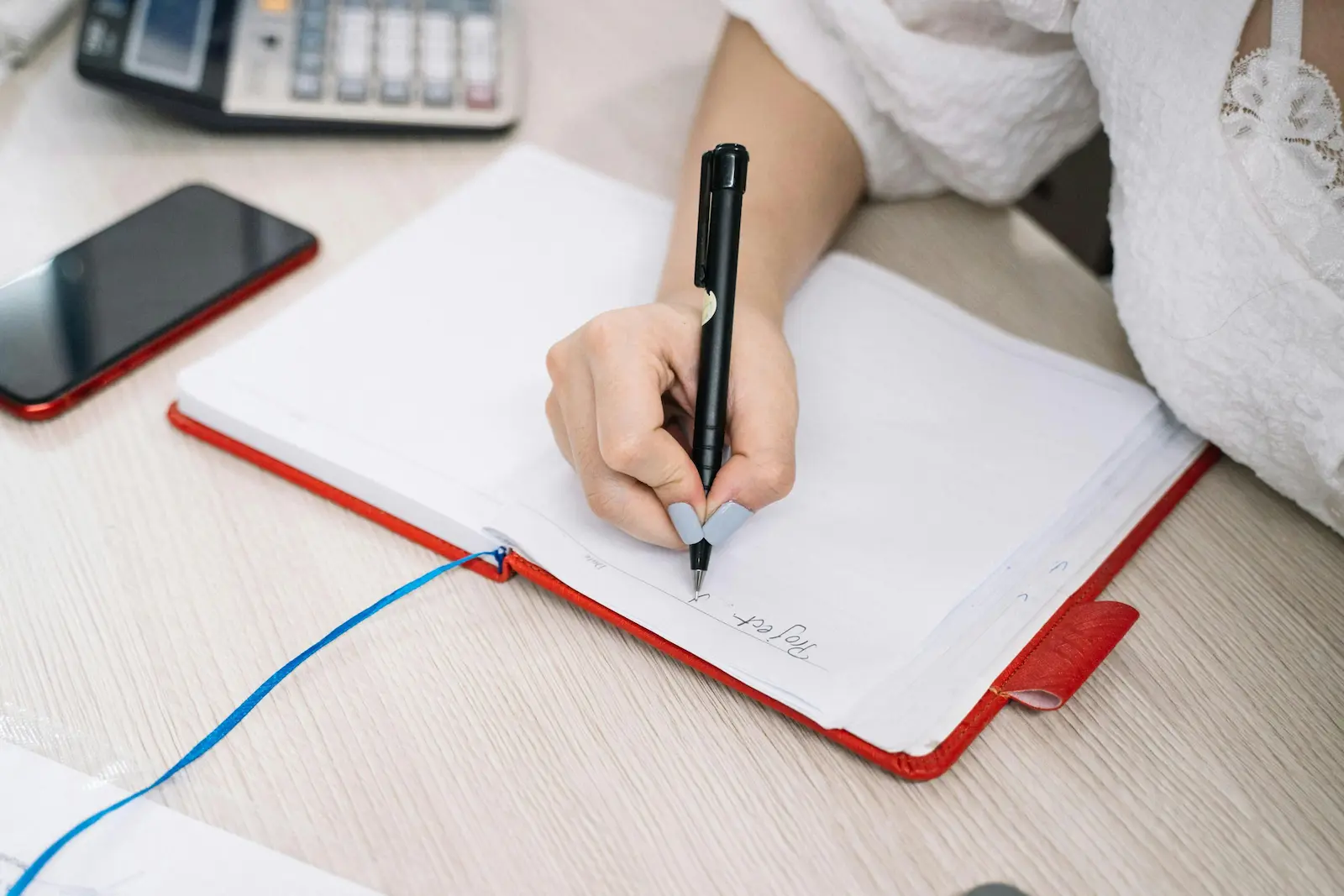 Copywriter writing conversion-focused copy at desk with laptop